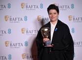 Charlotte Wells poses with the award for outstanding debut by a British writer, director or producer 'Aftersun' at the Bafta Film Awards ceremony in London (Picture Justin Tallis/AFP via Getty Images)