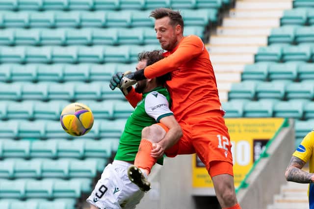 St Johnstone goalkeeper Elliot Parish rises above Christian Doidge as they overcame Hibs 1-0.