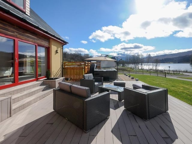 Decked terrace and hot tub area.