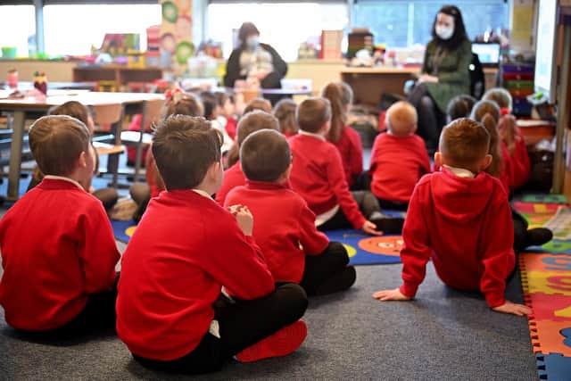 Teacher and class (Photo by Jeff J Mitchell/Getty Images)
