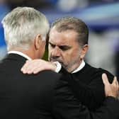 Celtic head coach Ange Postecoglou, right, and Real Madrid's counterpart Carlo Ancelotti greet each other before the start of their Champions League group match at the Bernabeu. (AP Photo/Manu Fernandez)