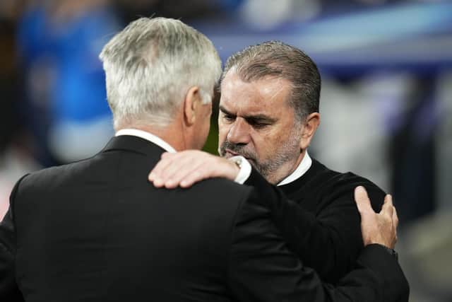 Celtic head coach Ange Postecoglou, right, and Real Madrid's counterpart Carlo Ancelotti greet each other before the start of their Champions League group match at the Bernabeu. (AP Photo/Manu Fernandez)