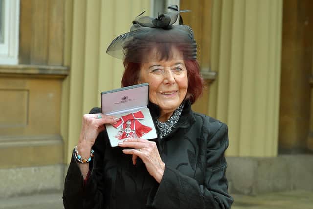Author Alanna Knight poses with her MBE in 2014