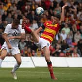 Partick Thistle's Brian Graham challenges Ross County's Ben Purrington during the Premiership play-off final first leg at Firhill. (Photo by Craig Foy / SNS Group)