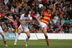Partick Thistle's Brian Graham challenges Ross County's Ben Purrington during the Premiership play-off final first leg at Firhill. (Photo by Craig Foy / SNS Group)
