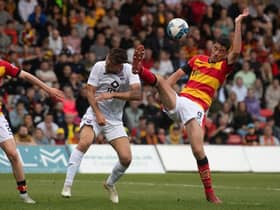 Partick Thistle's Brian Graham challenges Ross County's Ben Purrington during the Premiership play-off final first leg at Firhill. (Photo by Craig Foy / SNS Group)