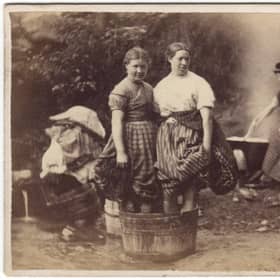 A card depicting women in the Highlands