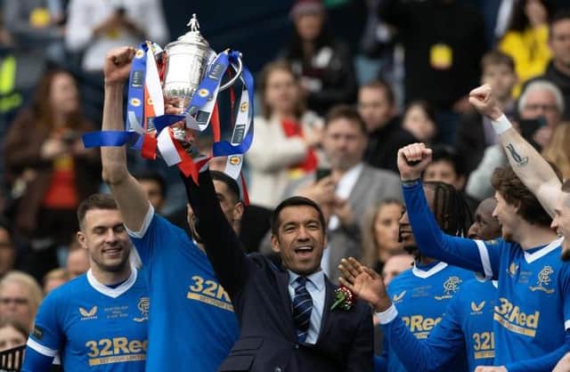Giovanni van Bronckhorst celebrates his first trophy as Rangers manager as he holds the Scottish Cup aloft at Hampden. (Photo by Craig Williamson / SNS Group)