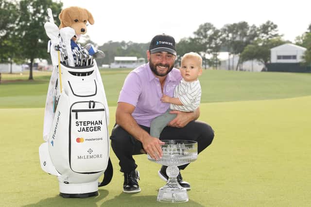 Stephan Jaeger poses with the trophy and his son Fritz after winning the Texas Children's Houston Open at Memorial Park Golf Course in Houston.Picture: Joe Scarnici/Getty Images.
