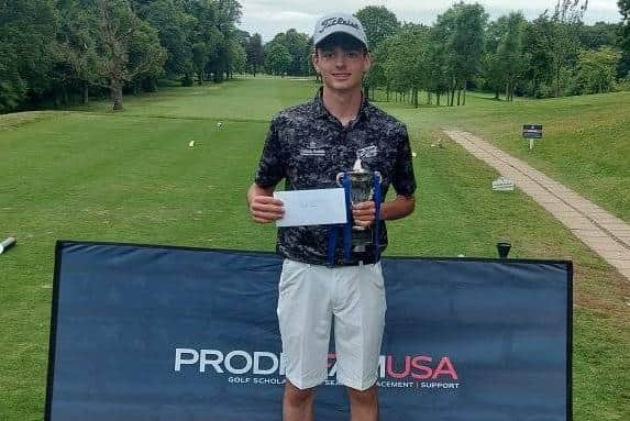 Aidan Lawson shows off the trophy after winning the boys' event in the ProDreamUSA Junior Masters at Pollok.