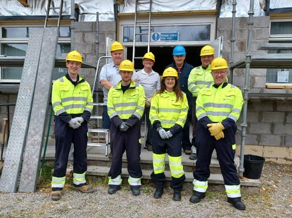 Volunteers from SSEN Transmission and the local community outside the Bothie ahead of the clear-up.