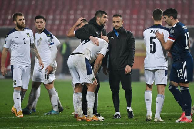 Serbia's players are disconsolate at the end.