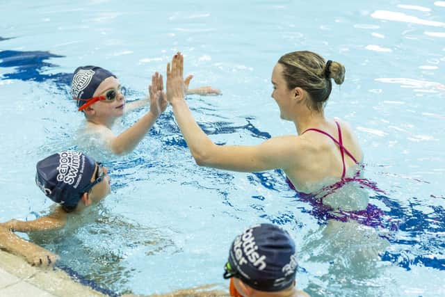 Toni Shaw with children at the Royal Commonwealth Pool Edinburgh
