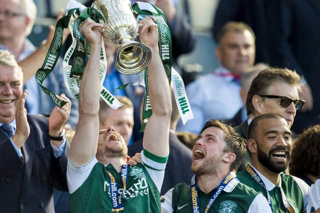 Hibernian skipper David Gray lifts the Scottish Cup at the top of the Hampden stairs in 2016 after the club's 114-year wait