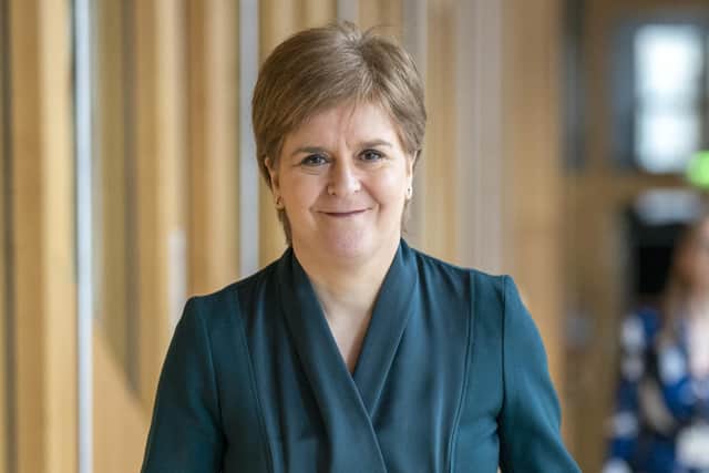 First Minister Nicola Sturgeon arrives ahead of First Minster's Questions (FMQ's) in the main chamber of the Scottish Parliament in Edinburgh.