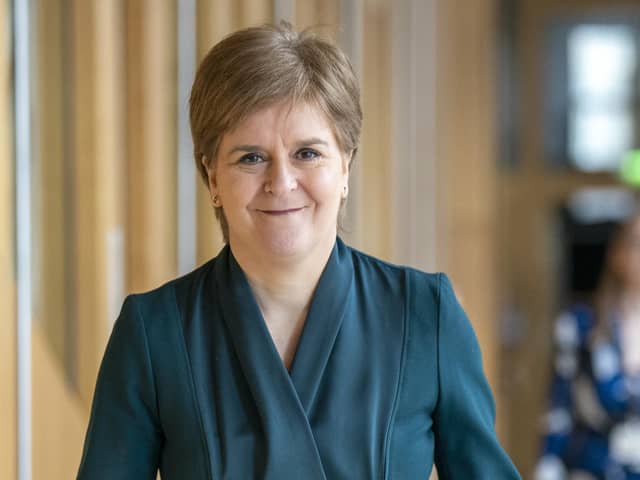 First Minister Nicola Sturgeon arrives ahead of First Minster's Questions (FMQ's) in the main chamber of the Scottish Parliament in Edinburgh.