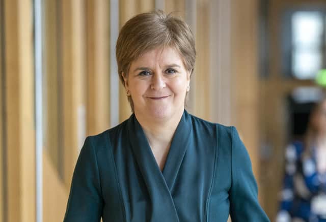 First Minister Nicola Sturgeon arrives ahead of First Minster's Questions (FMQ's) in the main chamber of the Scottish Parliament in Edinburgh.