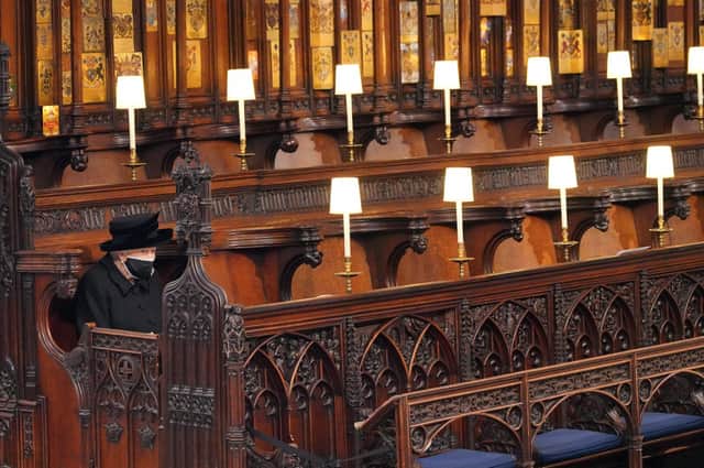 Queen Elizabeth II takes her seat during the funeral of Prince Philip