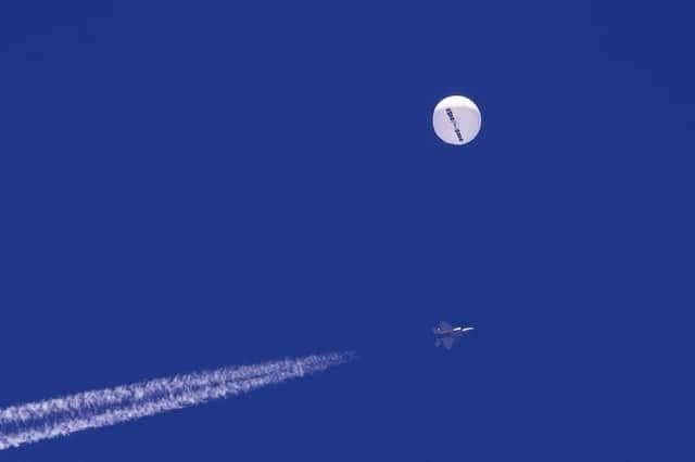 A Chinese balloon drifts above the Atlantic Ocean, just off the coast of South Carolina, shortly before it was shot down by a US fighter jet (Picture: Chad Fish via AP)