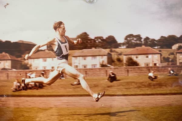 Hugh Murray racing across the track