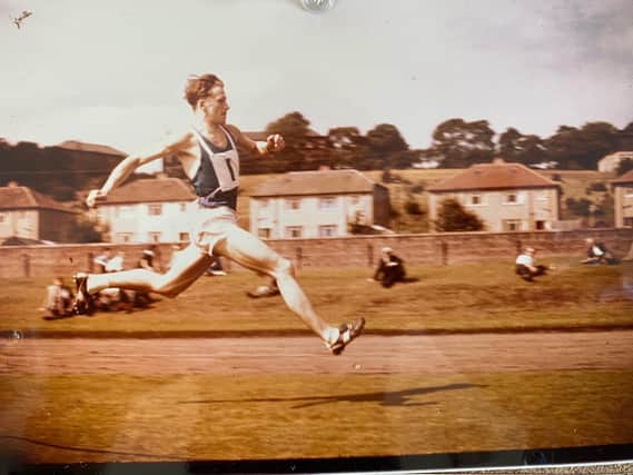 Hugh Murray racing across the track