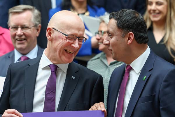 John Swinney sees the funny side of something in conversation with Scottish Labour leader Anas Sarwar this week (Picture: Jeff J Mitchell/Getty Images)