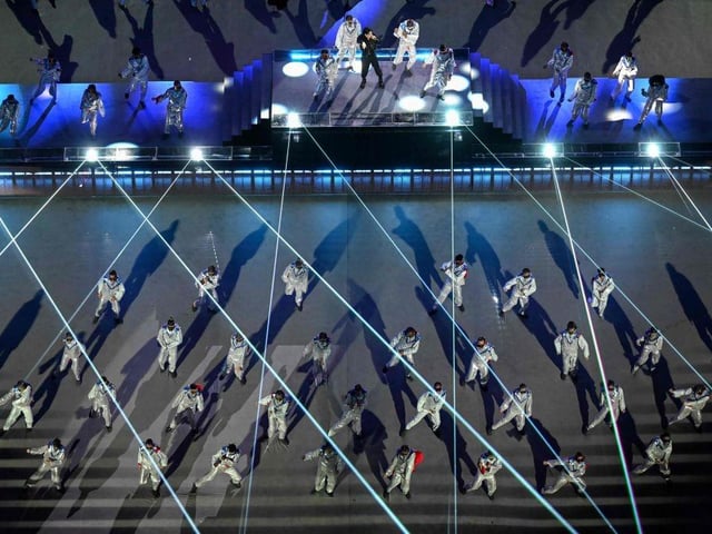 South Korean singer Jung Kook was joined by futuristic dancers during his performance at the ceremony.