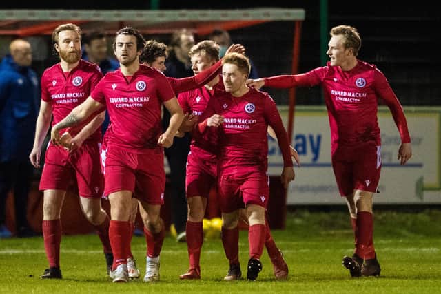 Brora players celebrate Jordan MacRae's goal to make it 1-0 against Hearts