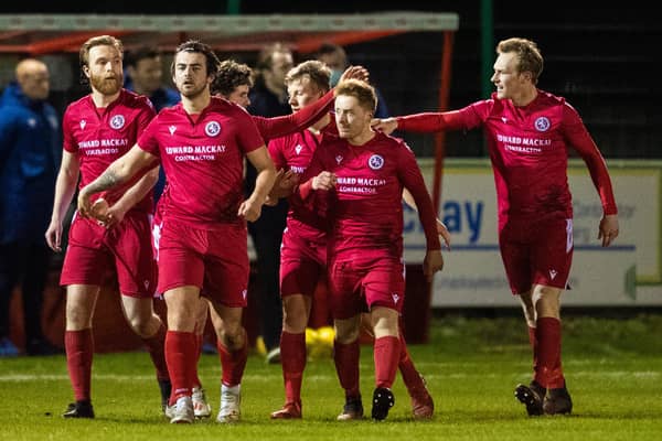 Brora players celebrate Jordan MacRae's goal to make it 1-0 against Hearts
