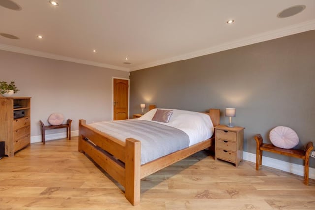The extremely spacious master bedroom has doors opening onto the rear seating terrace. Four of the property's six bedrooms are on the ground floor and one of the bedrooms on the upper floor has its own sitting room.