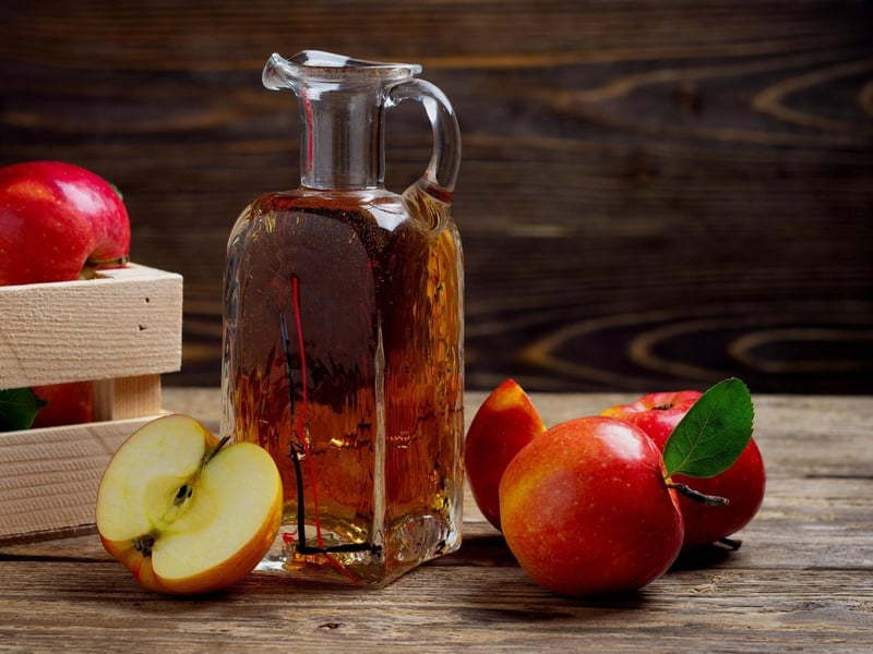 An effective way to resolve a fruit fly infestation is to trap them in a container of fluid to drown them, and there are many options for this. Fruit flies are attracted to the smell of fermenting foods (that smell vinegary) so this is effective for luring them in. To trap them, use a tall jar with a funnel made from a sheet of paper or a bottle with a narrow mouth. Then fill the vessel with apple cider vinegar and allow them to trap themselves.