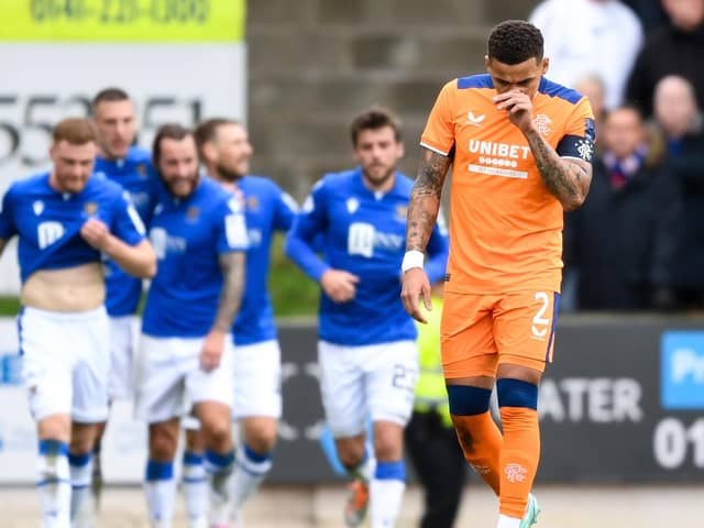 Rangers captain James Tavernier hangs his head as St Johnstone players celebrate going 1-0 up. (Photo by Ross MacDonald / SNS Group)
