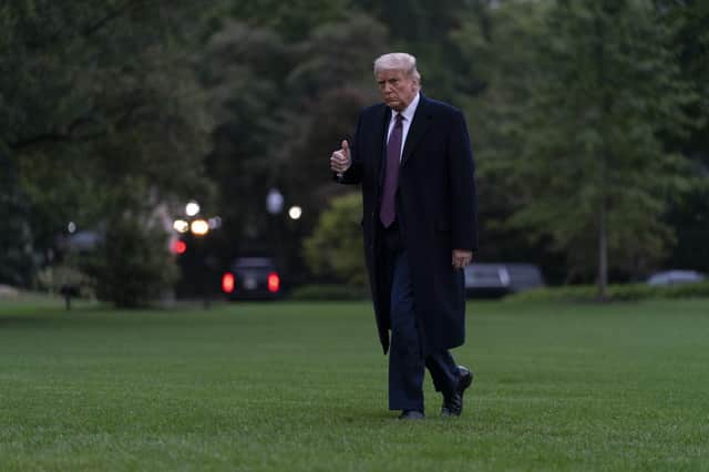 President Donald Trump gives the thumbs up as he returns to the White House from his New Jersey golf resort on Thursday. Picture: Carolyn Kaster/AP
