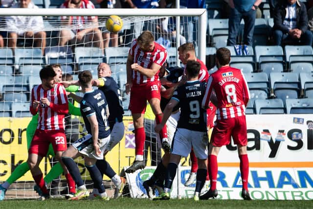 Shaun Rooney heads home St Johnstone's equaliser against Dundee.