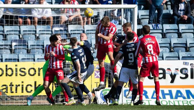Shaun Rooney heads home St Johnstone's equaliser against Dundee.