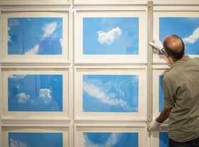 A technician installing Always Take the Weather With You, 2014, by Rohini Devasher at the Love of Print show at Kelvingrove PIC: Ross MacDonald - SNS Group