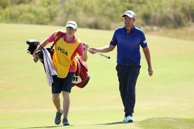 Padraig Harrington hands a club to caddie Ronan Flood during the final round of the 2021 PGA Championship at Kiawah Island. Picture: Jamie Squire/Getty Images.