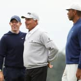 Rory McIlroy, Fred Couples and Tiger Woods talk on the 18th green during a practice round prior to the 2023 Masters at Augusta National Golf Club. Picture: Christian Petersen/Getty Images.