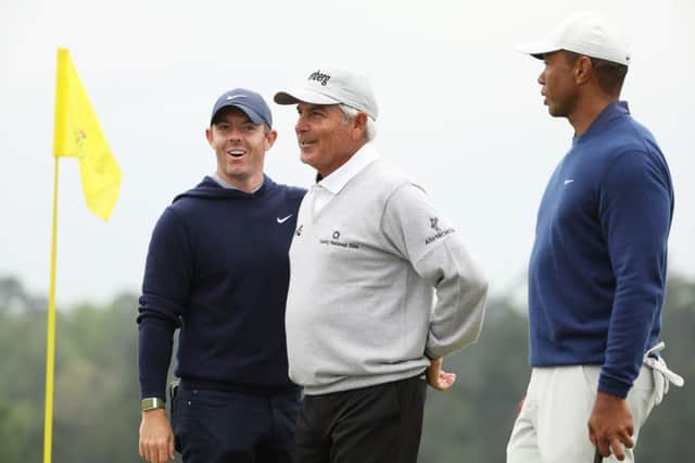 Rory McIlroy, Fred Couples and Tiger Woods talk on the 18th green during a practice round prior to the 2023 Masters at Augusta National Golf Club. Picture: Christian Petersen/Getty Images.
