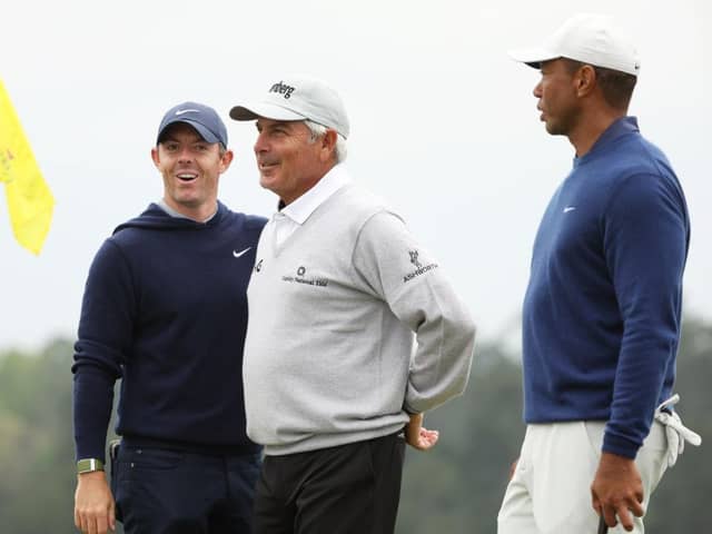 Rory McIlroy, Fred Couples and Tiger Woods talk on the 18th green during a practice round prior to the 2023 Masters at Augusta National Golf Club. Picture: Christian Petersen/Getty Images.