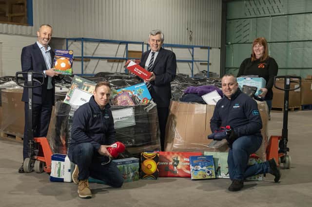 AMAZON charity coalition  - Back (from left) John Boumphey, (Amazon UK Country Manager,  Rt Hon Gordon Brown,, Pauline Buchan (Manager of Cottage family Centre), 
Front - Simon McMahon, and  Ben Robertson -  Amazon Dunfermline.