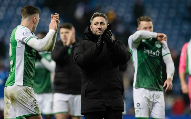 Hibs manager Lee Johnson applauds the away fans at full time after the 3-2 defeat to Rangers at Ibrox.  (Photo by Craig Williamson / SNS Group)