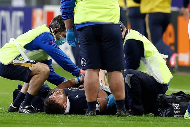 Rory Sutherland receives treatment for a shoulder injury during Scotland's Six Nations win over France in Paris. Picture: SNS