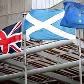 A Union Jack, Saltire and European flag fly outside the Scottish Parliament in Edinburgh. Picture: PA