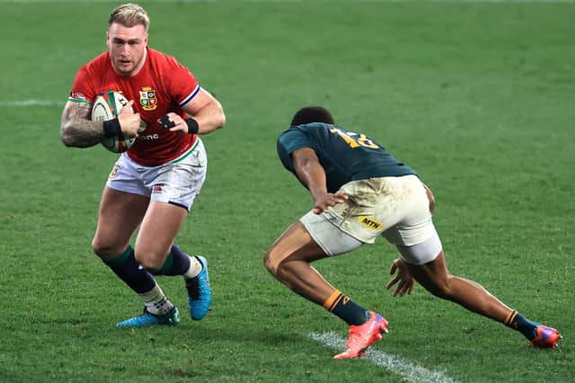 Scotland star Stuart Hogg takes on Lukhanyo Am during this weekend's match between the British and Irish Lions and South Africa in Cape Town