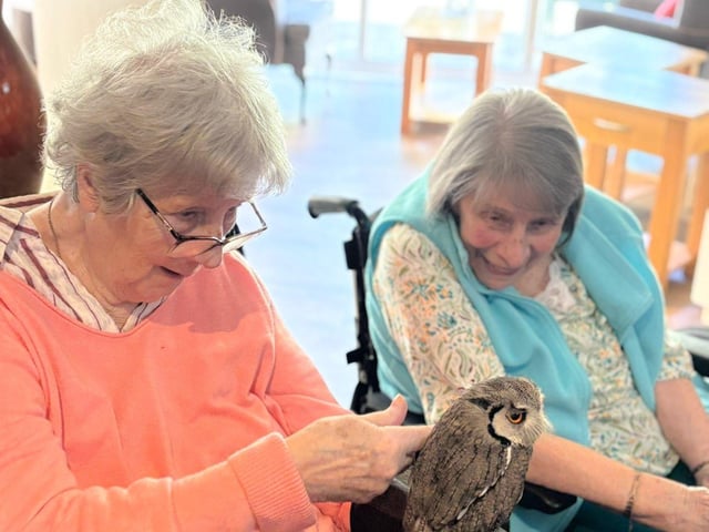 residents enjoying holding the birds