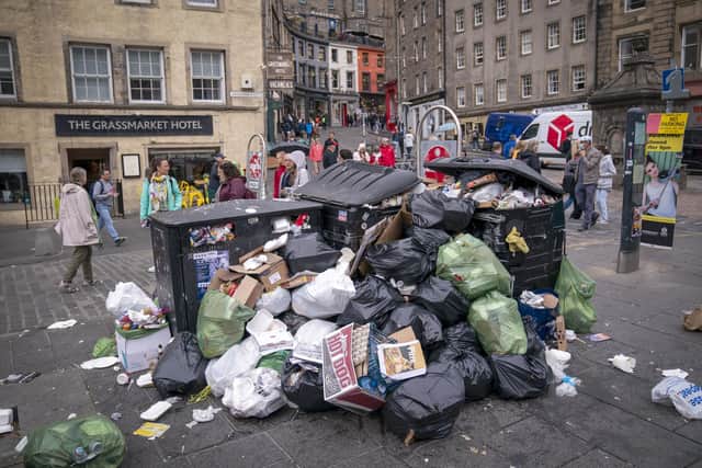 Bins and litter in the Grassmarket in Edinburgh city centre. Cleansing workers at the City of Edinburgh Council are on an eleven day strike.