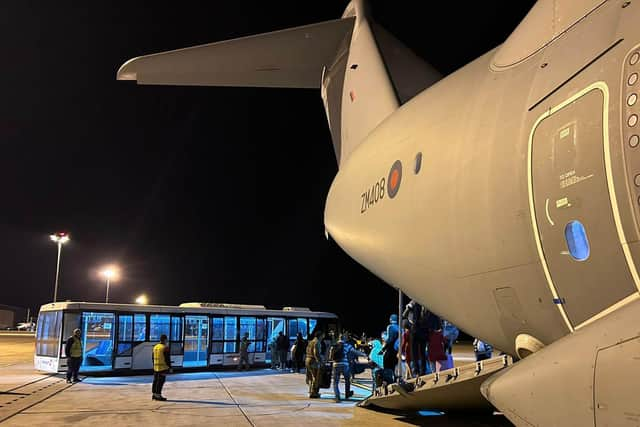 Photo issued by the Ministry of Defence (MoD) of UK nationals disembarking from an A400M transport plane at Larnaca International Airport in Cyprus. The first flight evacuating UK civilians from Sudan landed at the airport, with 39 people on board.