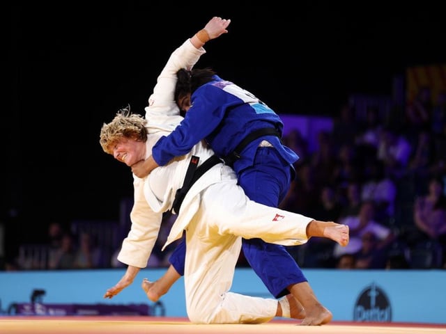 Sarah Adlington on her way to victory over Tulika Maan of Team India during the Women's Judo +78 kg Final match.