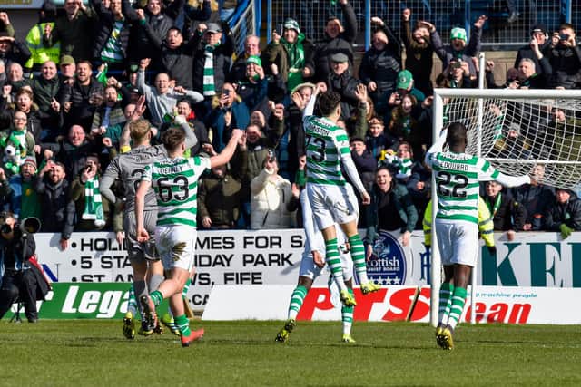 Celtic players celebrate in front of the away fans at Dens Park in 2019. Picture: SNS